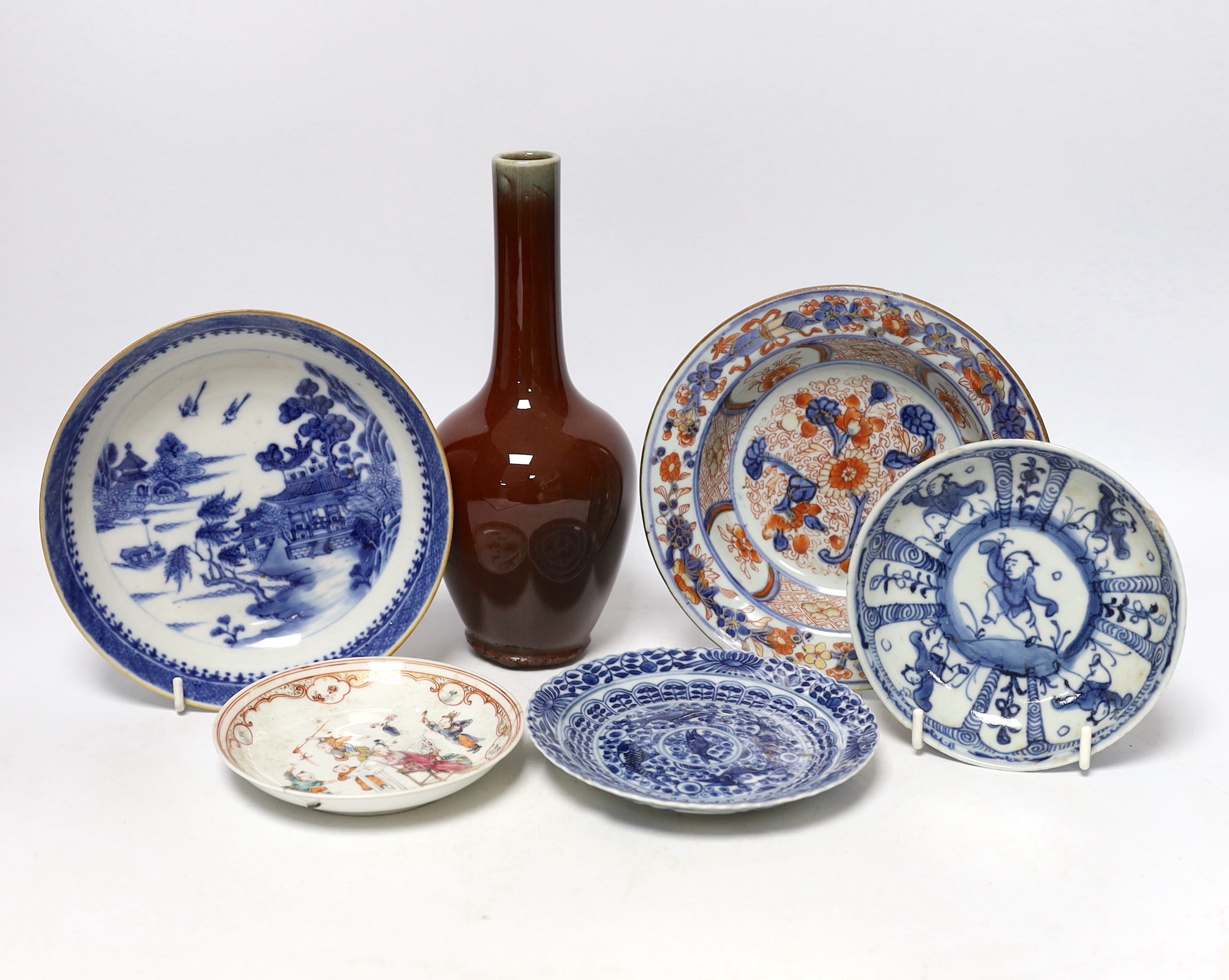 Five Chinese porcelain saucers and dishes and a sang de boeuf glazed vase, vase 21cm high